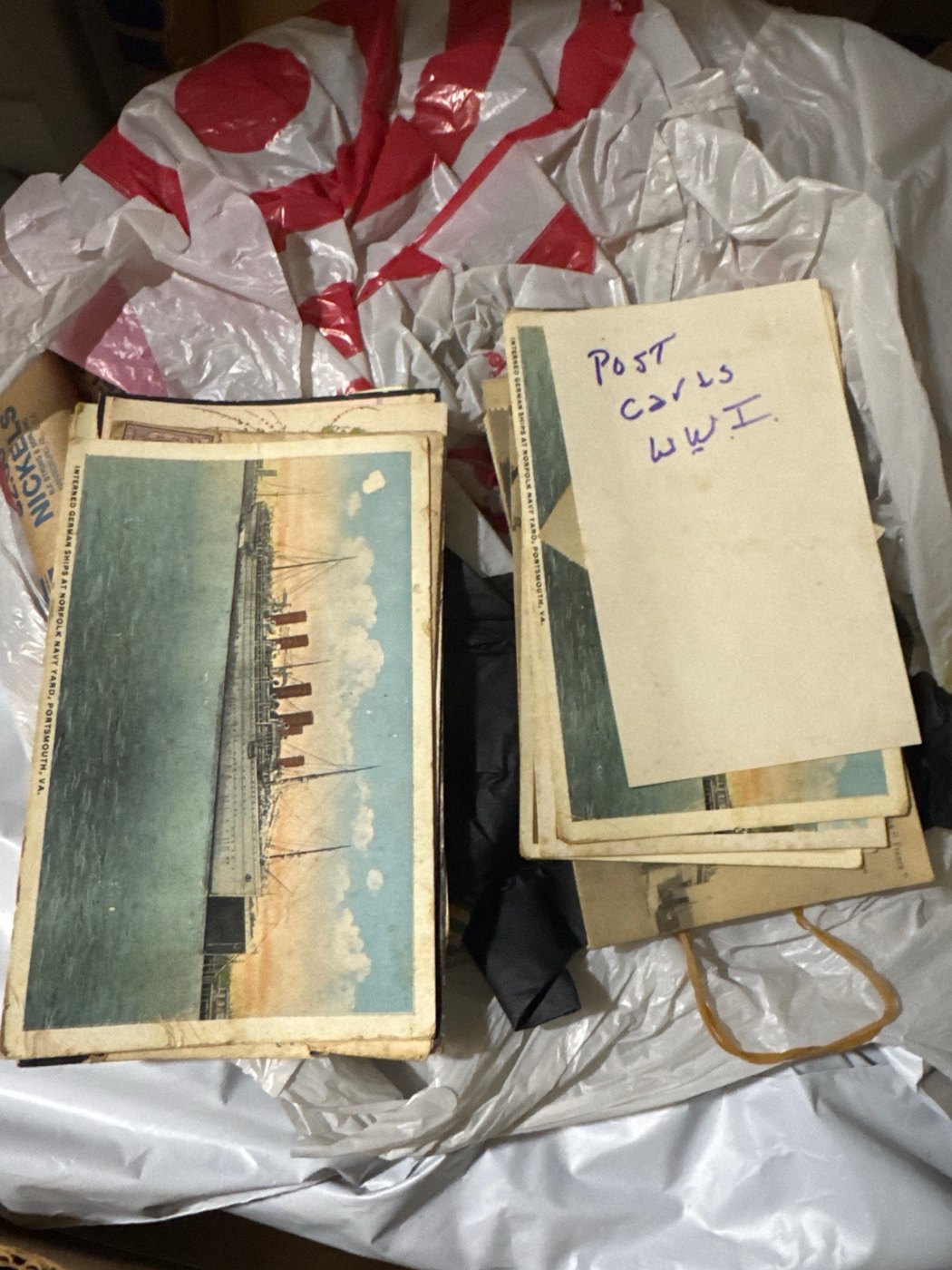 Collection of World War I naval postcards including interned German ships, original photo