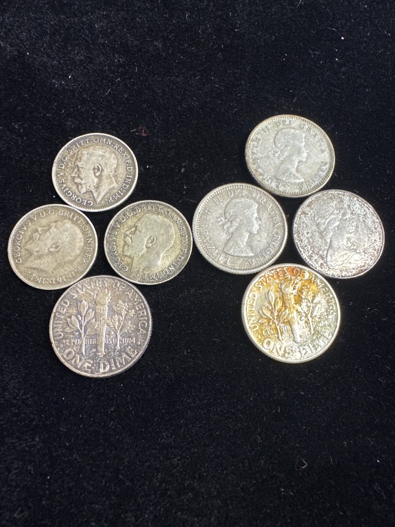 Reverse sides of the eight British, Canadian, and U.S. coins in the world silver lot